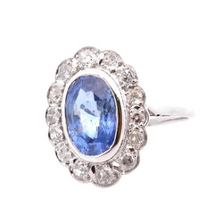 Bague Marguerite en platine, or jaune, saphir, et diamants - Castafiore