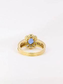 Bague marguerite vintage en or, saphir ovale et diamants - Castafiore