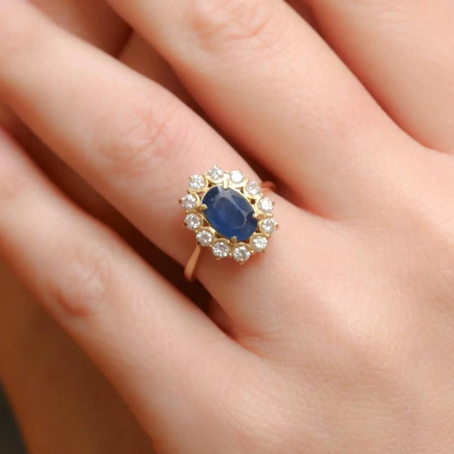 Bague marguerite vintage or diamants saphir ovale - Castafiore