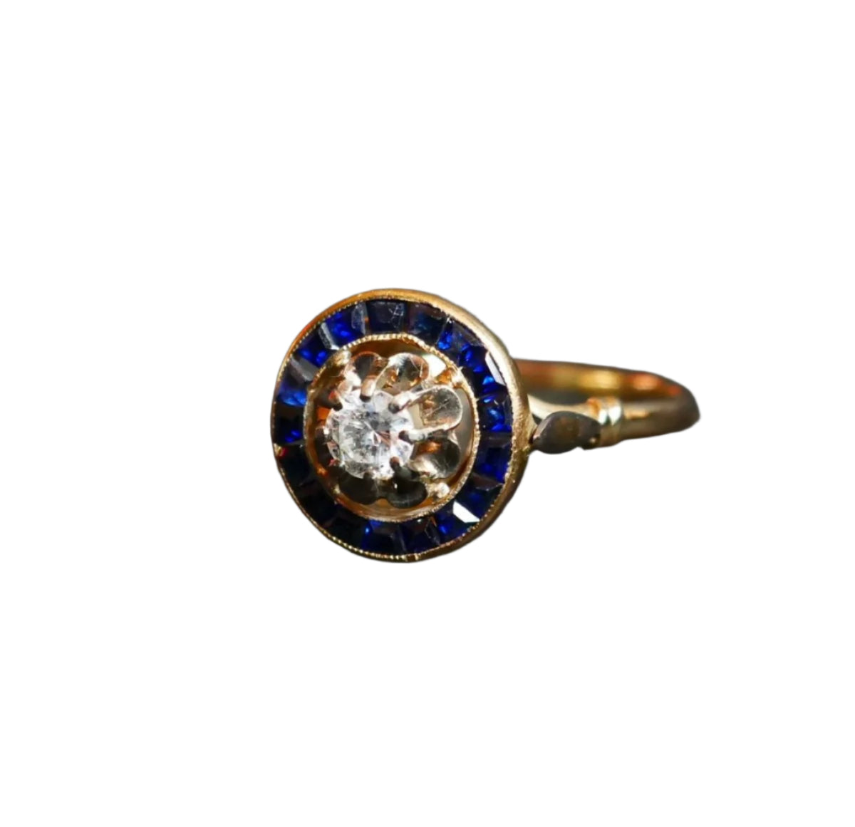 Bague Ornée d'Un Diamant, Entourage De Saphirs Calibrés - Castafiore
