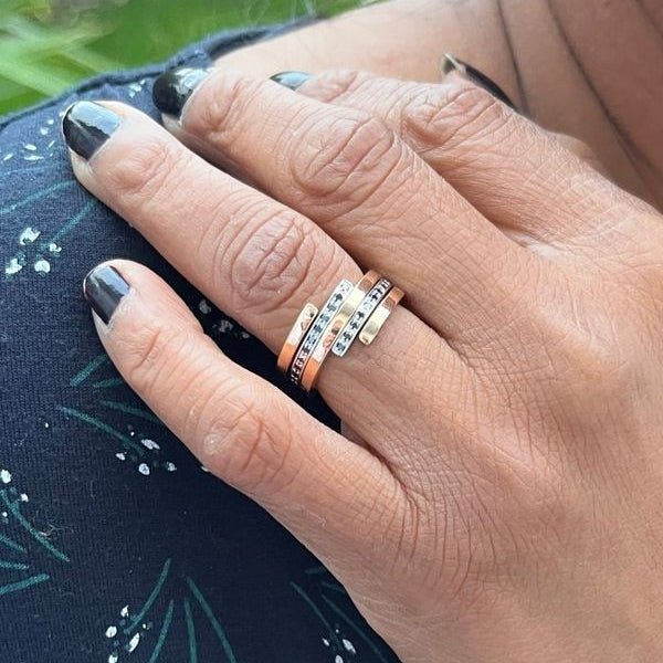 Bagues DINH VAN "Spirale" en or blanc, or jaune, argent et diamant - Castafiore