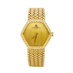 BAUME & MERCIER Montre vintage or jaune maille tressée - Castafiore