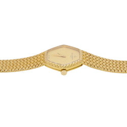 BAUME & MERCIER Montre vintage or jaune maille tressée - Castafiore