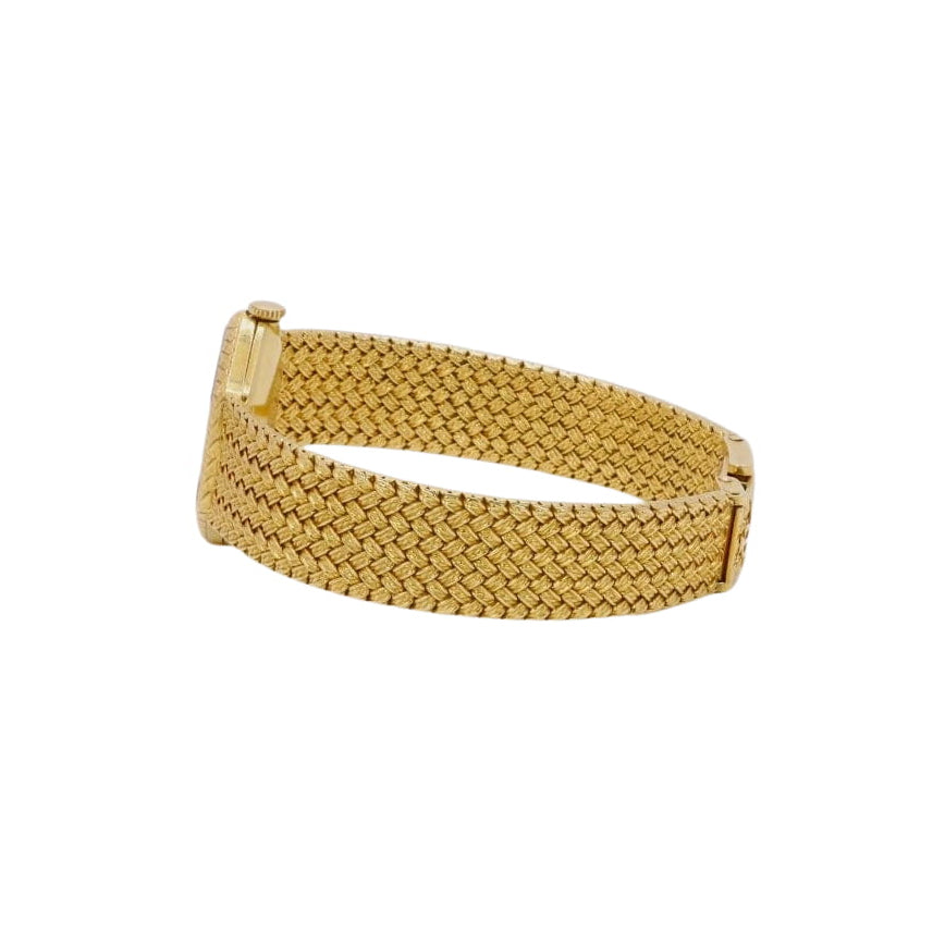 BAUME & MERCIER Montre vintage or jaune maille tressée - Castafiore