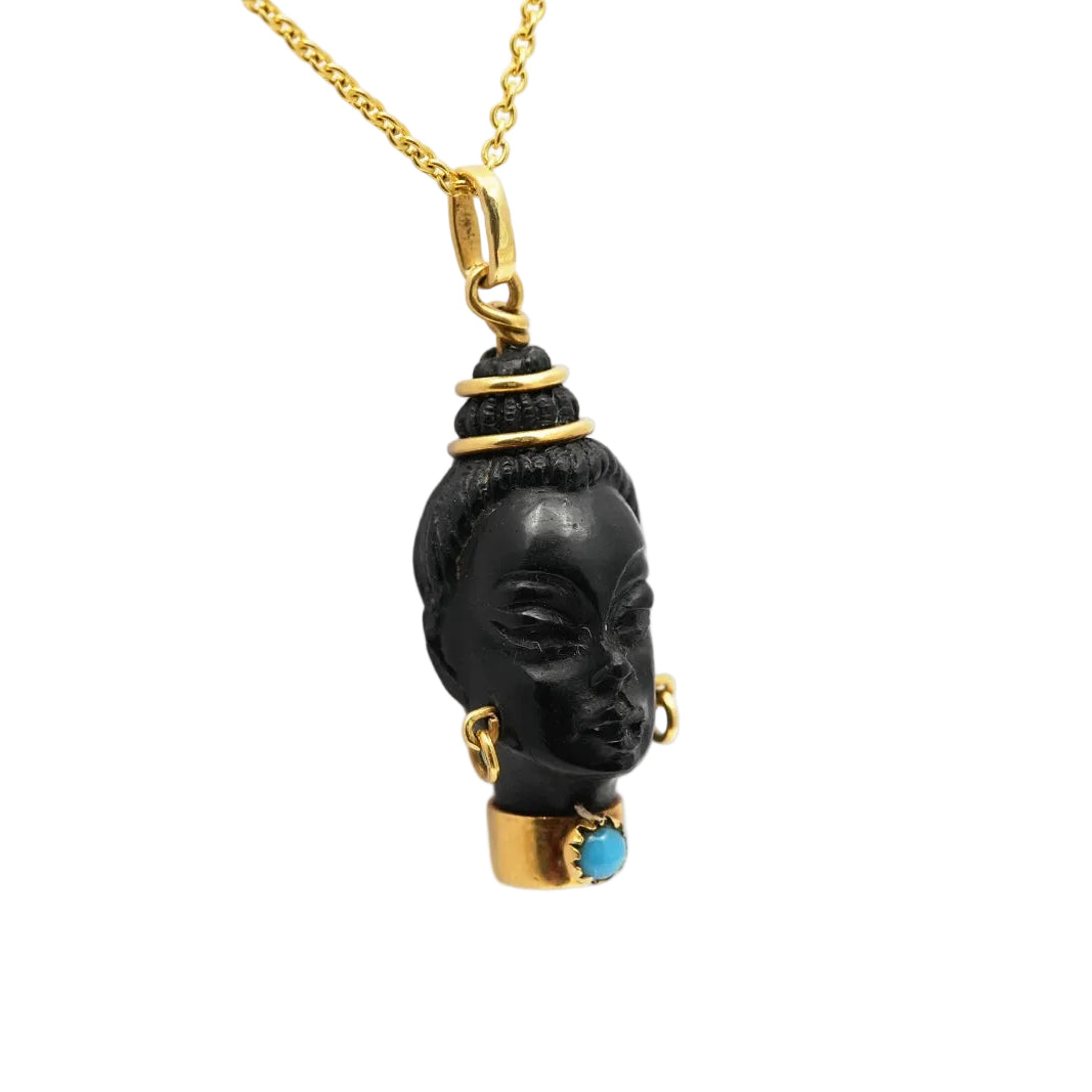 Yellow gold, ebony, and turquoise pendant