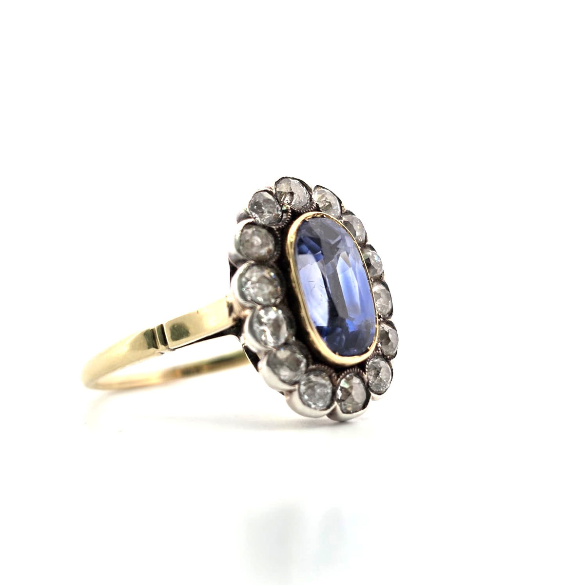 Entourage Ring in yellow gold, silver, sapphire, and diamonds
