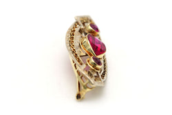 Broche Épingle en or jaune et rubis