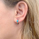 Boucles d'oreilles POMELLATO "M'ama non M'ama" en or rose, zircons et turquoises - Castafiore