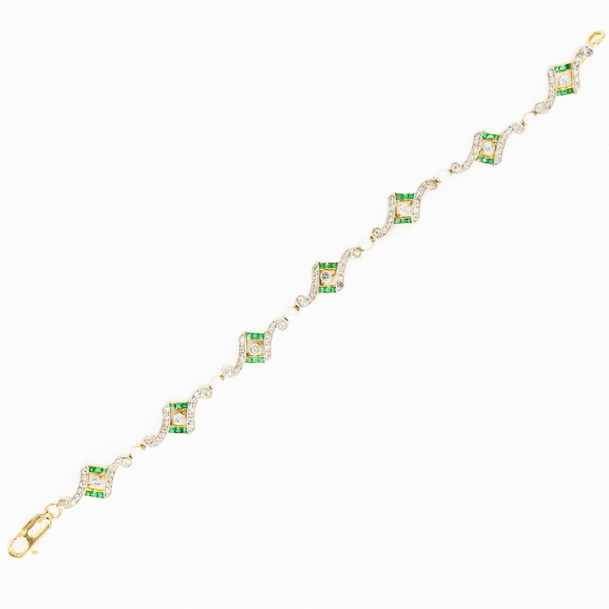 Bracelet Art Deco en or jaune, platine, perles, émeraudes et diamants - Castafiore