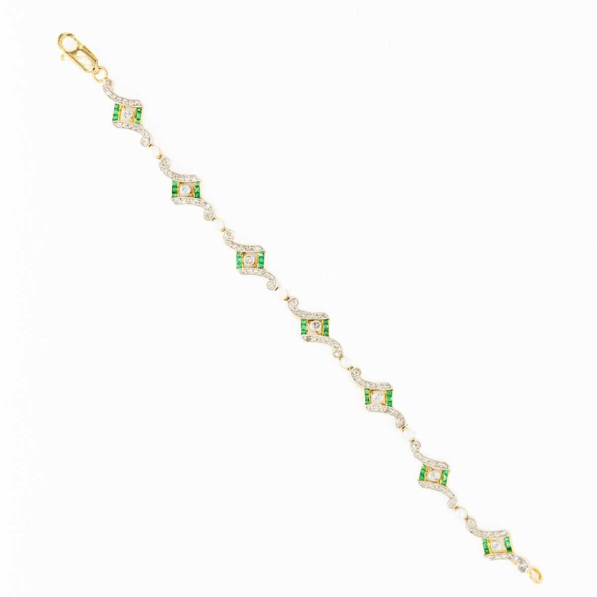 Bracelet Art Deco en or jaune, platine, perles, émeraudes et diamants - Castafiore