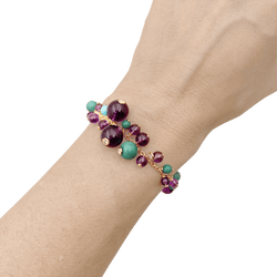 Bracelet Breloque CARTIER "Délices de Goa" en or jaune, turquoise, améthyste et diamants - Castafiore