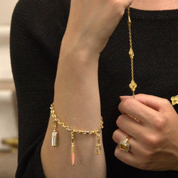 Bracelet Breloque CARTIER en or jaune, or blanc et résine - Castafiore