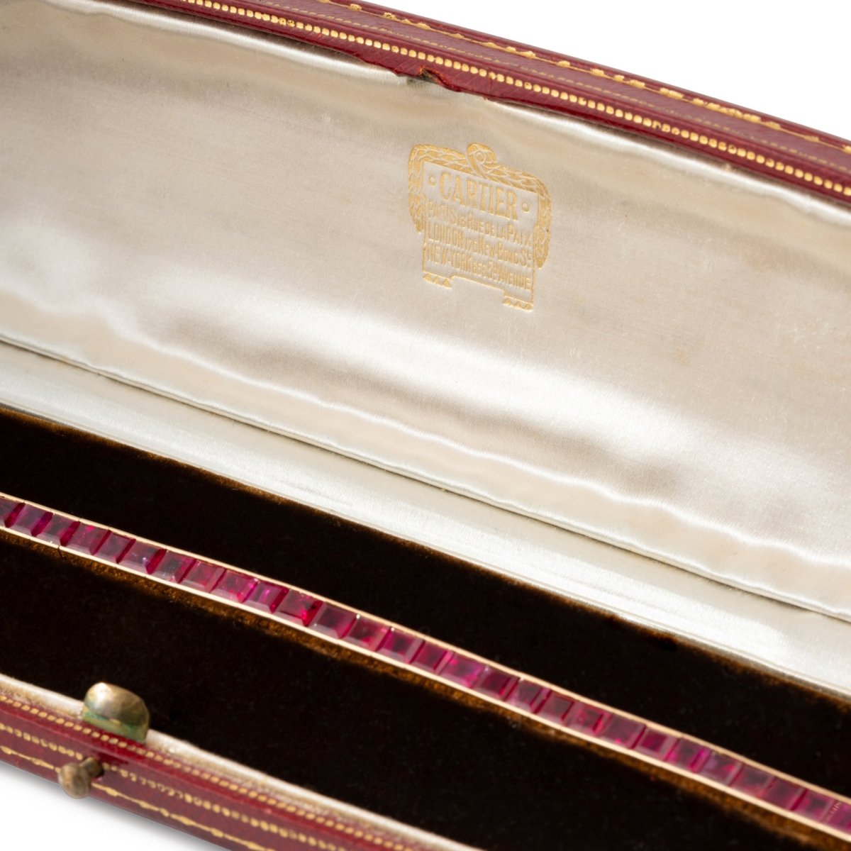 Bracelet CARTIER Ligne tennis en or jaune et rubis - Castafiore