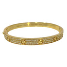 Bracelet CARTIER "Love" en or jaune avec diamants pavés - Castafiore