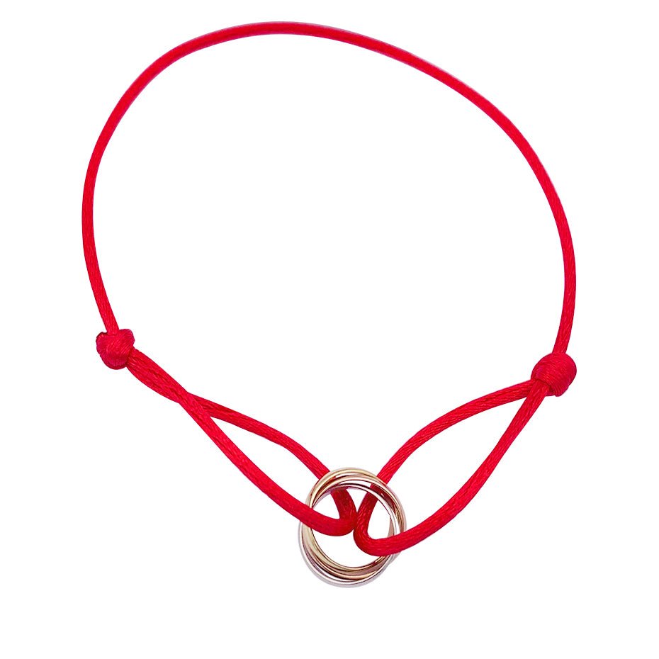 Bracelet CARTIER "Trinity" trois ors sur cordon - Castafiore