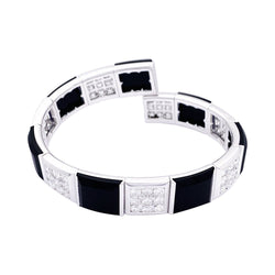 Bracelet CHANEL, "Harmonie", or blanc, diamants et onyx - Castafiore
