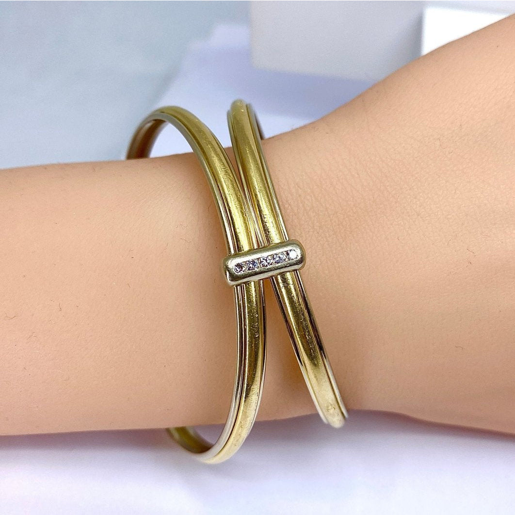 Bracelet double joncs or 18 carats, diamants, Yves Saint Laurent