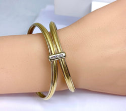 Bracelet double joncs or 18 carats, diamants, Yves Saint Laurent