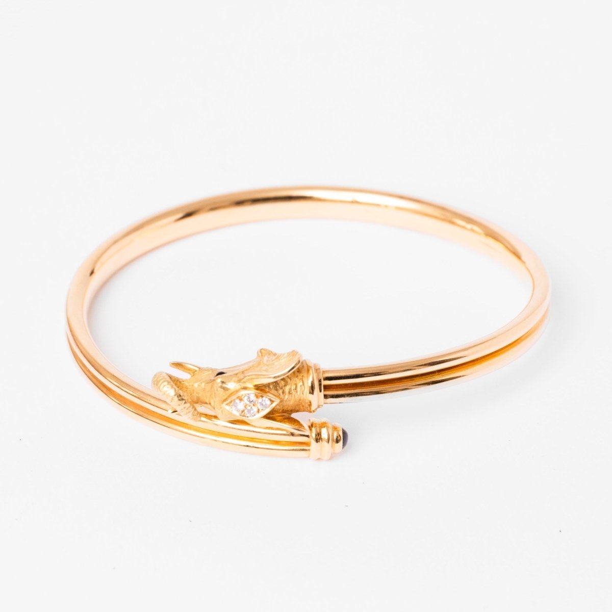 Bracelet JEAN ET PIERRE BELLIN Éléphant double jonc ouvert en or jaune, saphir, onyx et diamants - Castafiore