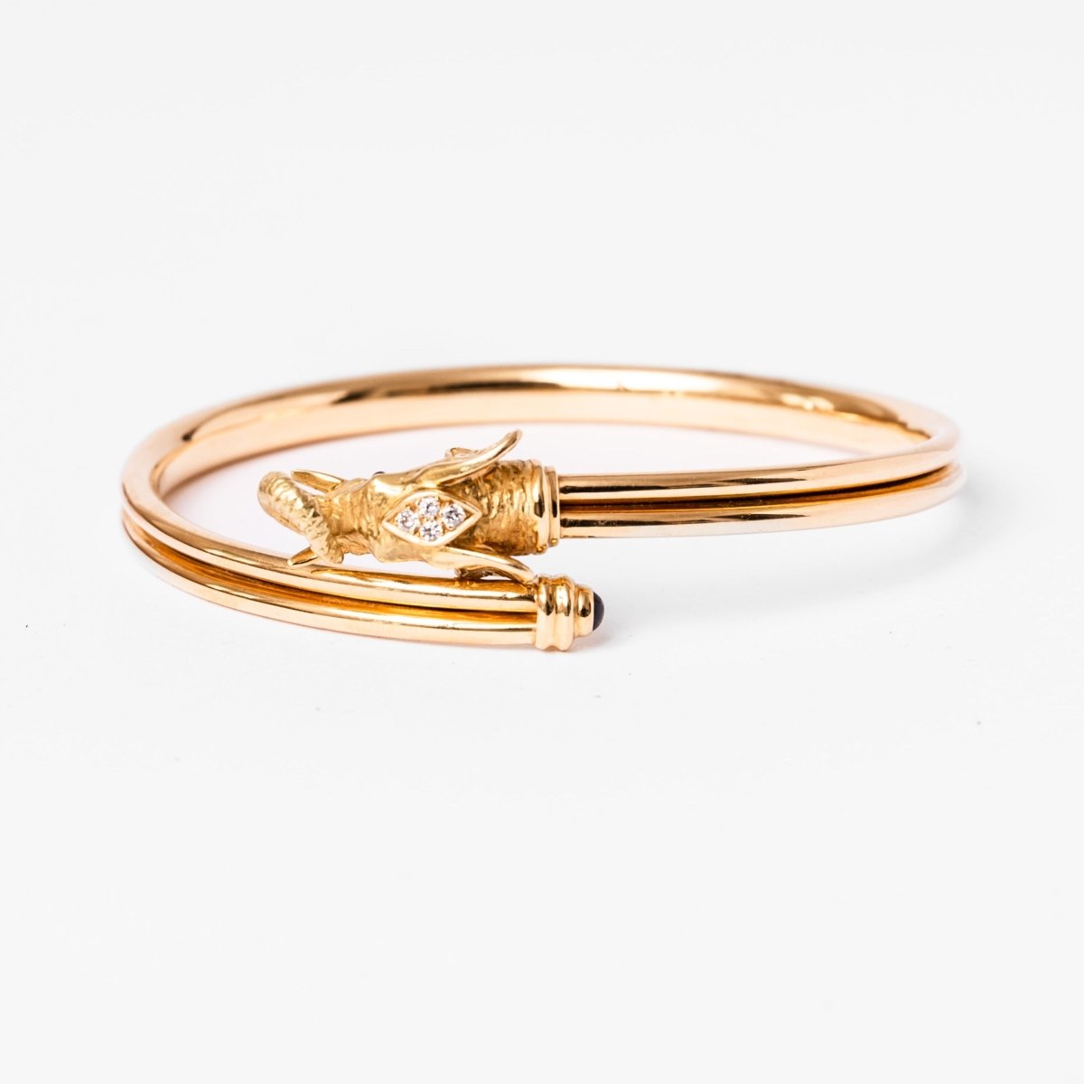 Bracelet JEAN ET PIERRE BELLIN Éléphant double jonc ouvert en or jaune, saphir, onyx et diamants - Castafiore