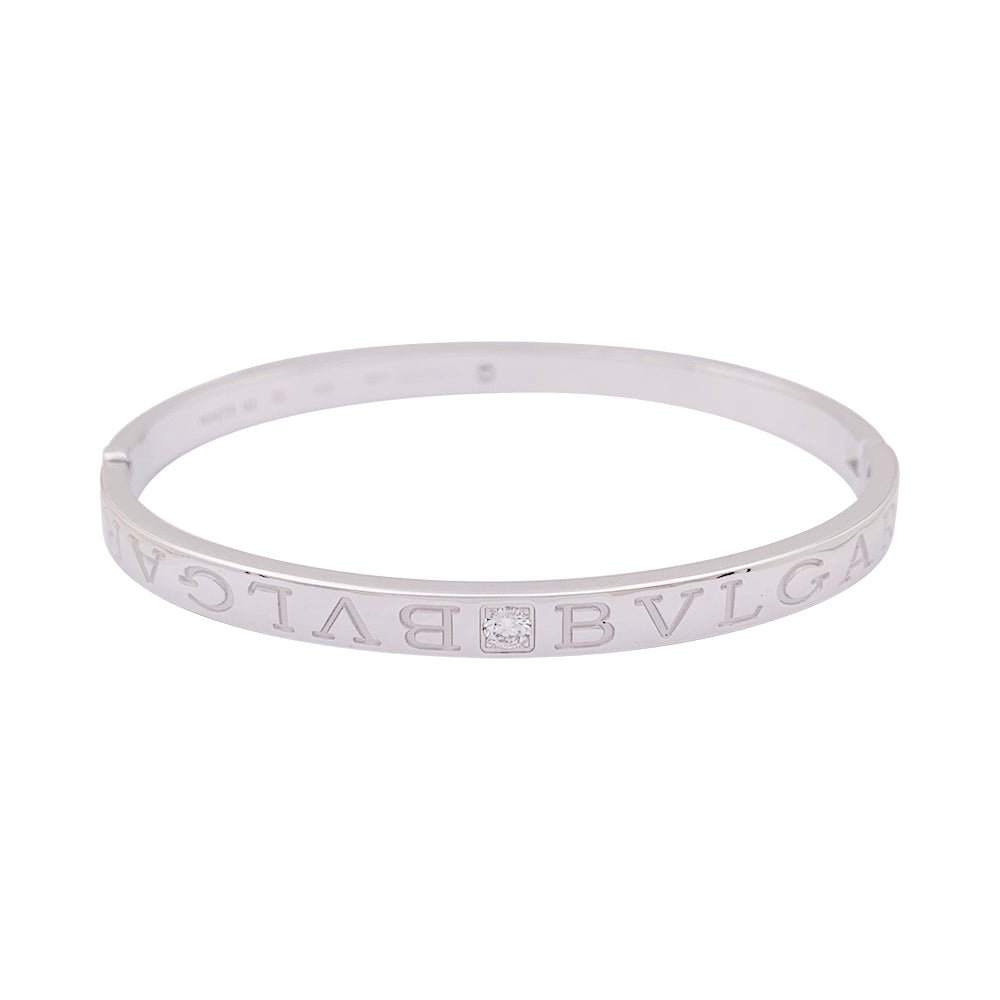 Bracelet jonc Bulgari "Bulgari Bulgari" or blanc, diamants. - Castafiore