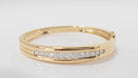 Bracelet jonc ouvrant en or jaune et diamants - Castafiore