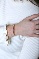 Bracelet Jonc ouvrant en or jaune, rubis calibrés et diamants - Castafiore
