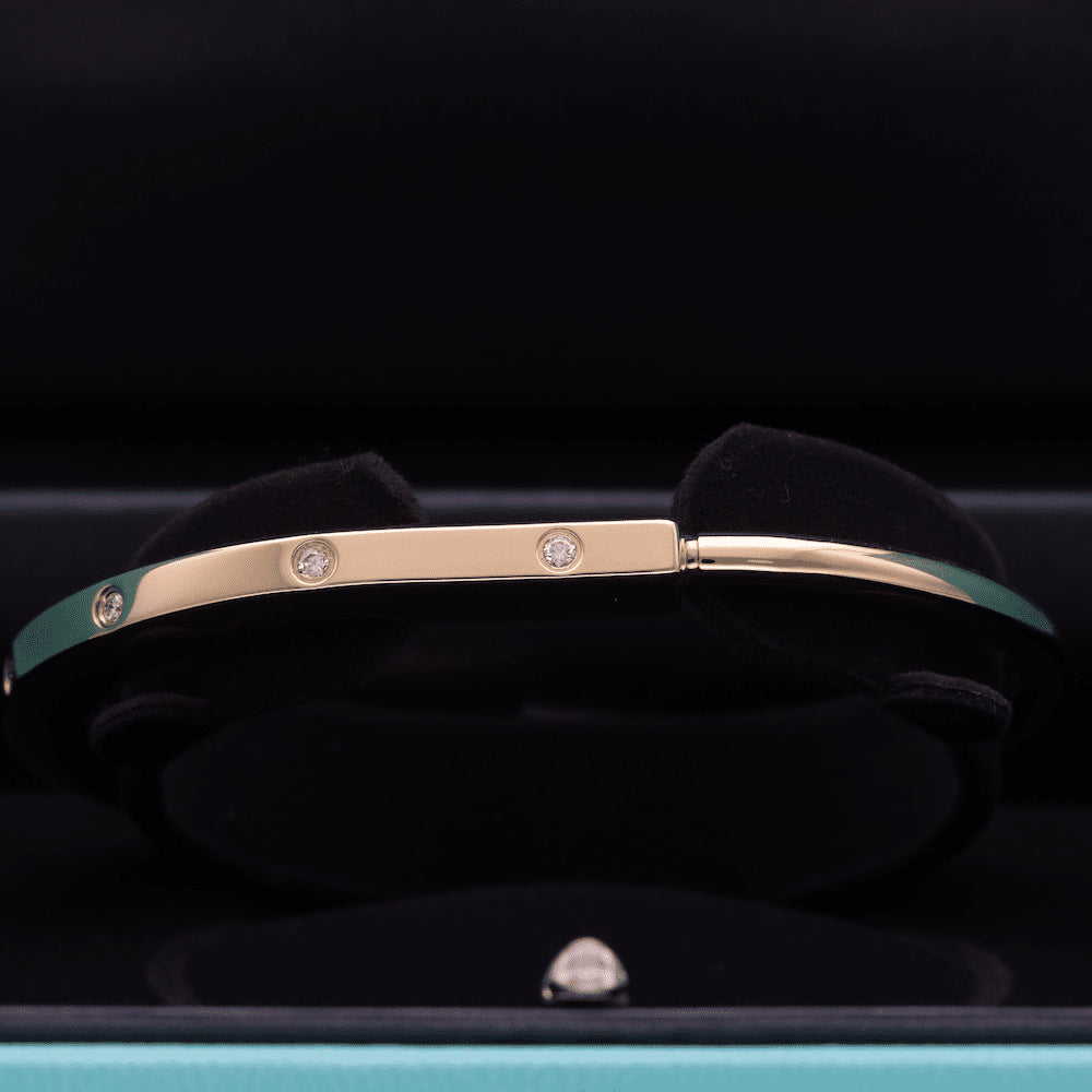 Bracelet Jonc TIFFANY & CO. "Lock" en or jaune et diamants - Castafiore