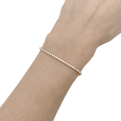 Bracelet ligne tennis en or rose, diamants. - Castafiore
