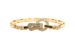 Bracelet Maille CARTIER "Agrafe" en or jaune et diamants - Castafiore