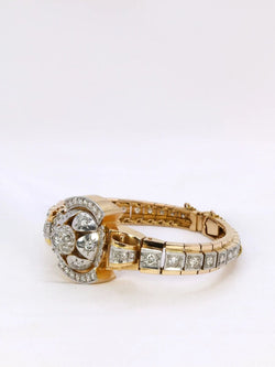 Bracelet Montre vintage en or jaune et diamants, 1950 - Castafiore