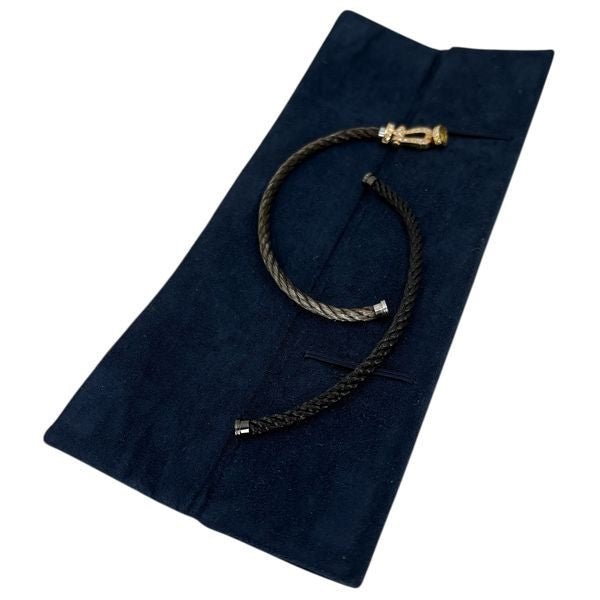 Bracelet Souple FRED "Force 10" en or jaune, acier et diamants - Castafiore