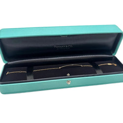 Bracelet TIFFANY & CO. "T" en or jaune et diamants - Castafiore