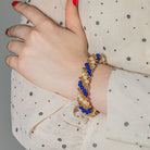 Bracelet VAN CLEEF & ARPELS "Twist" en or jaune, perles et lapis lazuli - Castafiore