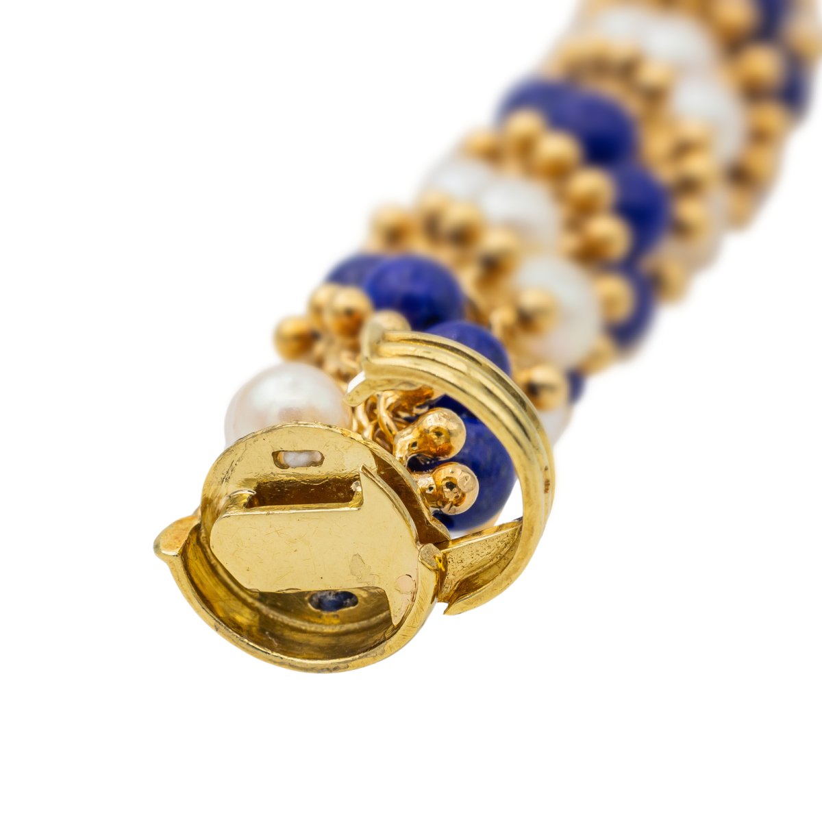 Bracelet VAN CLEEF & ARPELS "Twist" en or jaune, perles et lapis lazuli - Castafiore