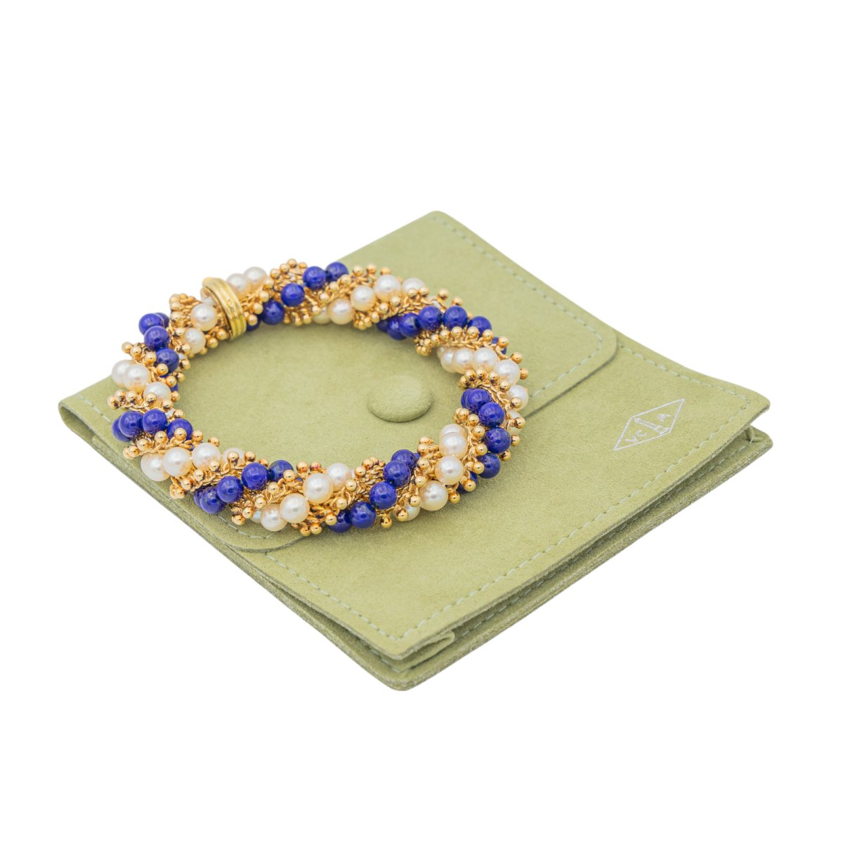 Bracelet VAN CLEEF & ARPELS "Twist" en or jaune, perles et lapis lazuli - Castafiore