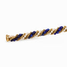 Bracelet VCA "Twist" en or jaune, perles et lapis - lazuli - Castafiore