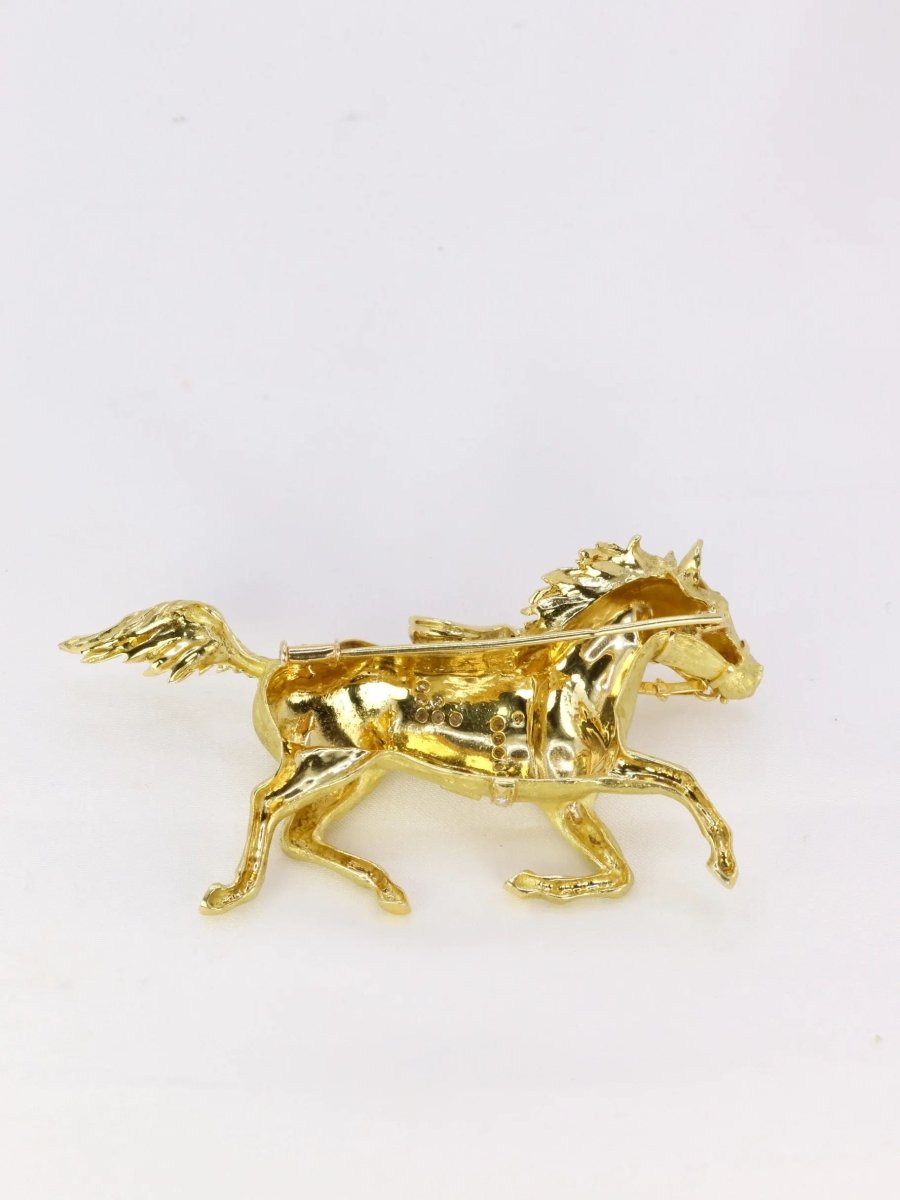 Broche animalière cheval en or jaune et diamants - Castafiore