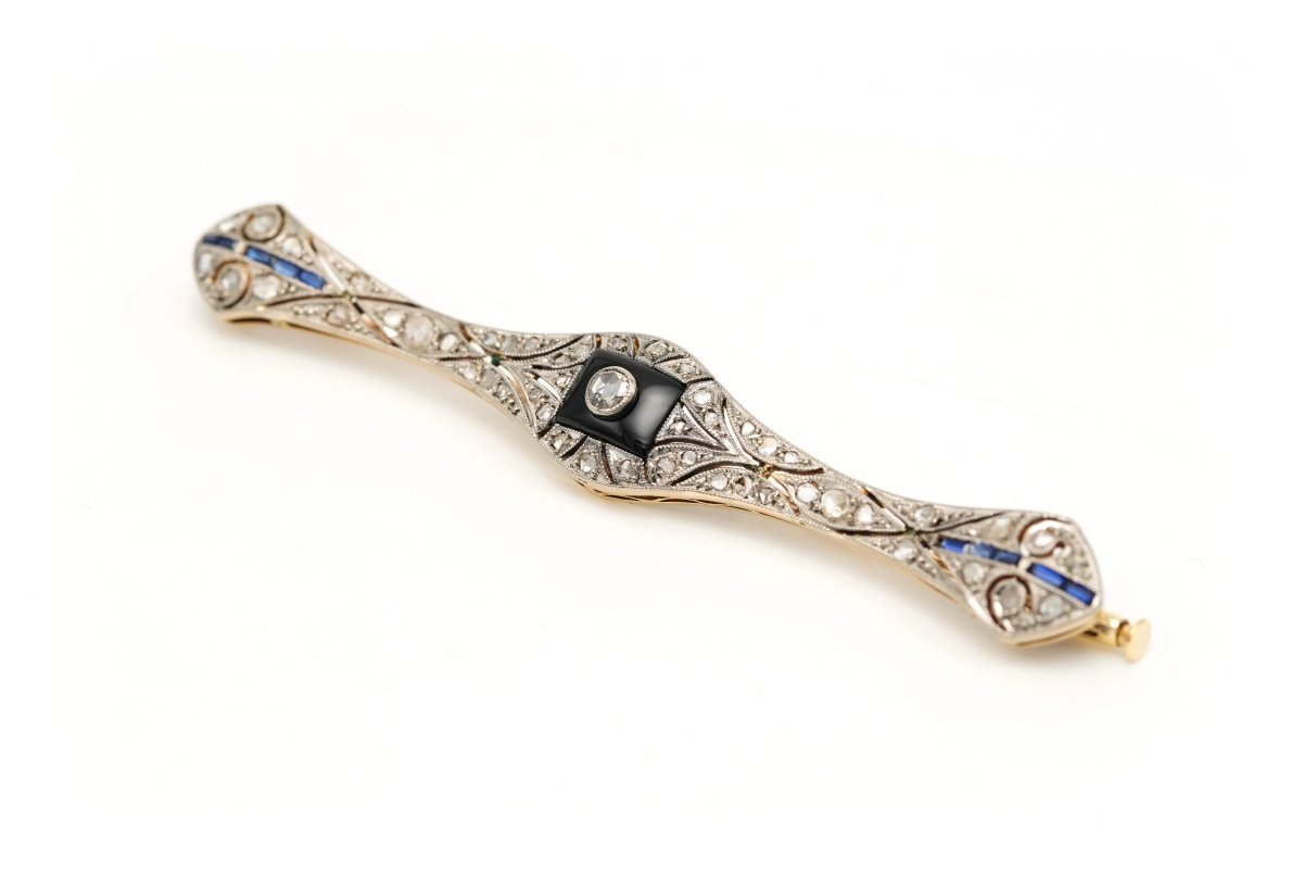 Broche Barrette en or blanc, or jaune, onyx, saphirs et diamants - Castafiore