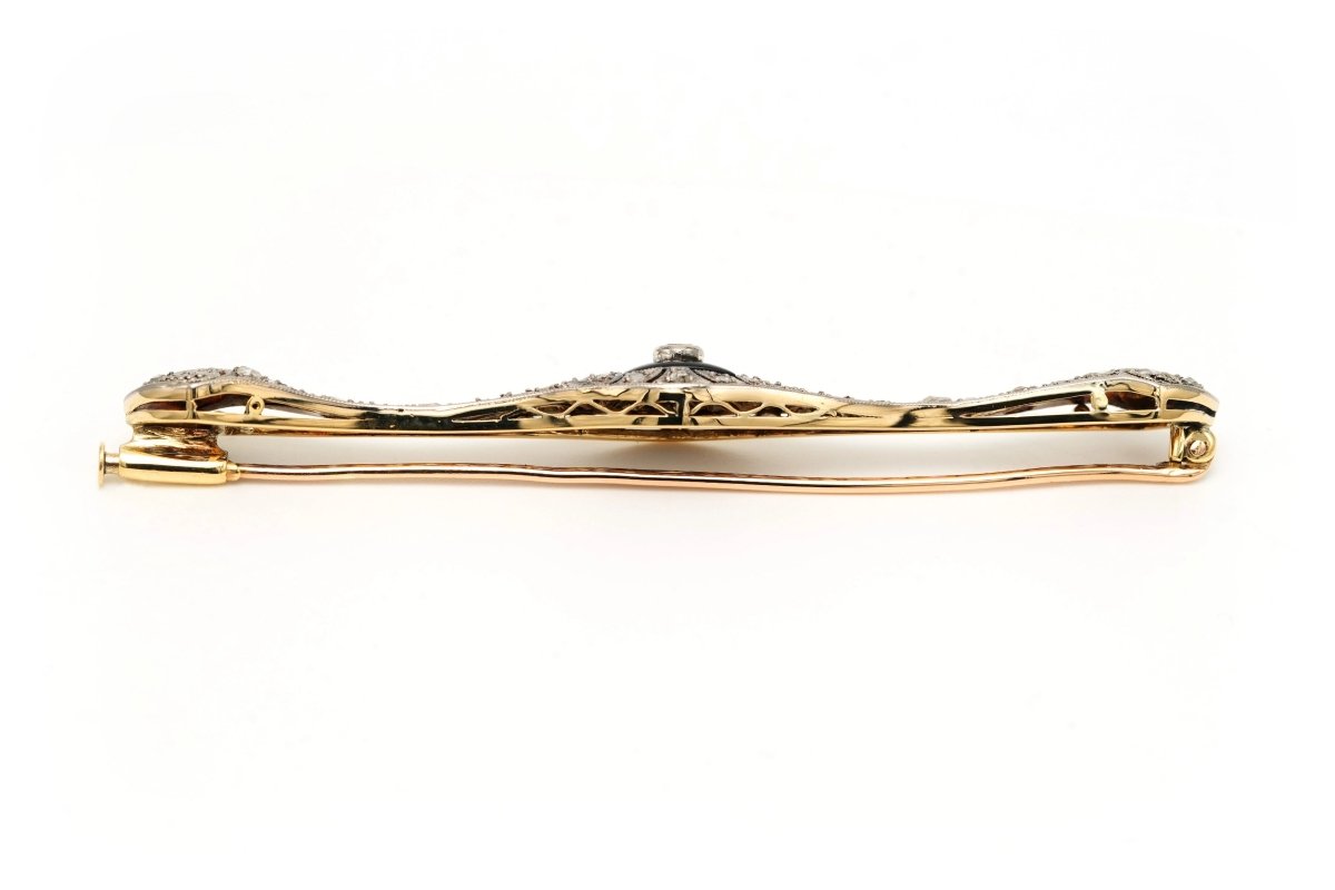 Broche Barrette en or blanc, or jaune, onyx, saphirs et diamants - Castafiore