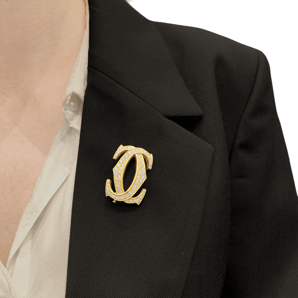 Brooch Cartier, "Double C", yellow gold, diamonds.