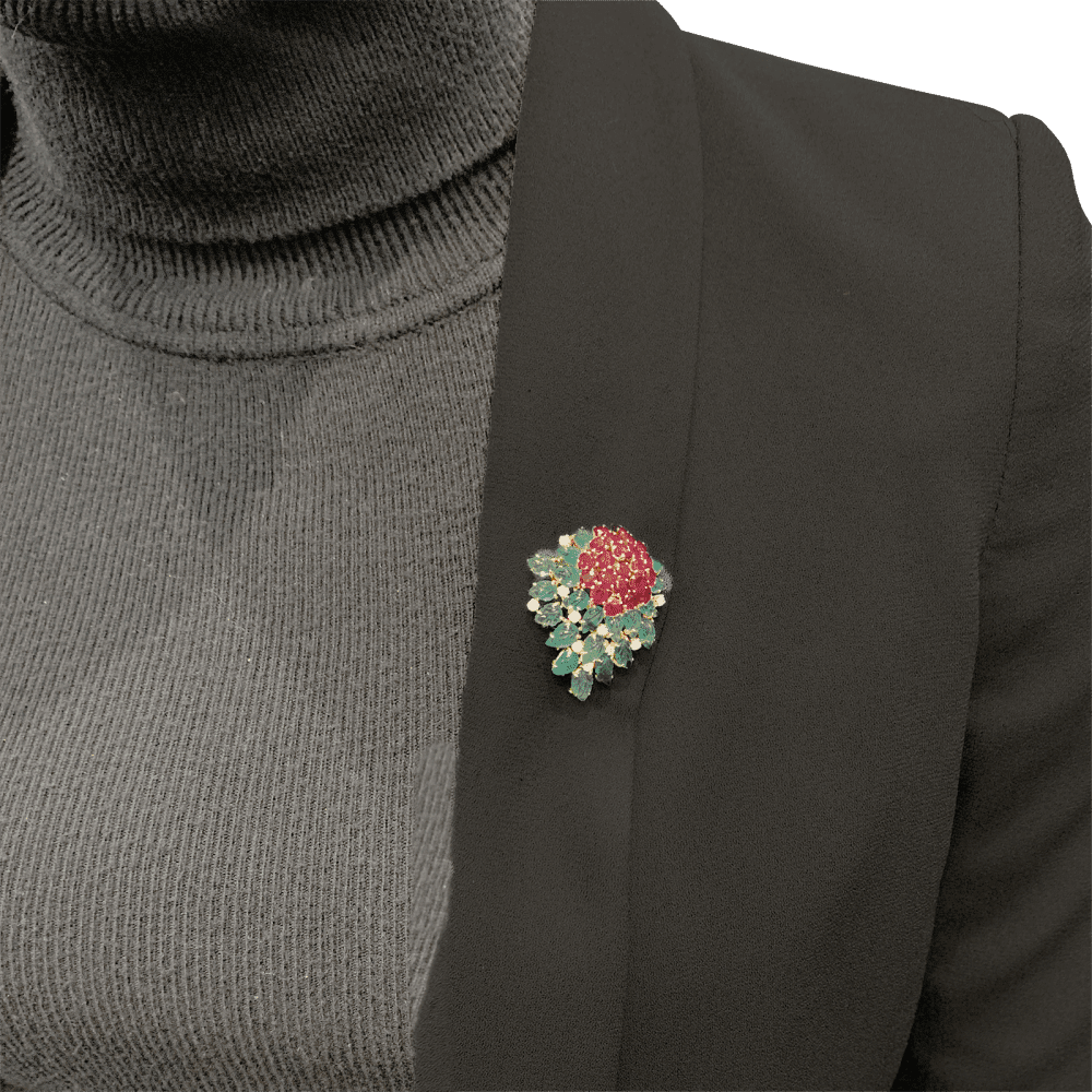 Floral clip, yellow gold, diamonds, emeralds, rubies.
