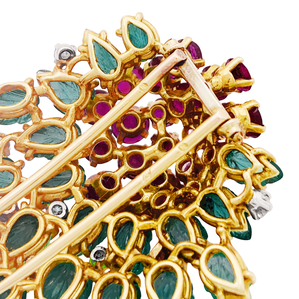 Floral clip, yellow gold, diamonds, emeralds, rubies.