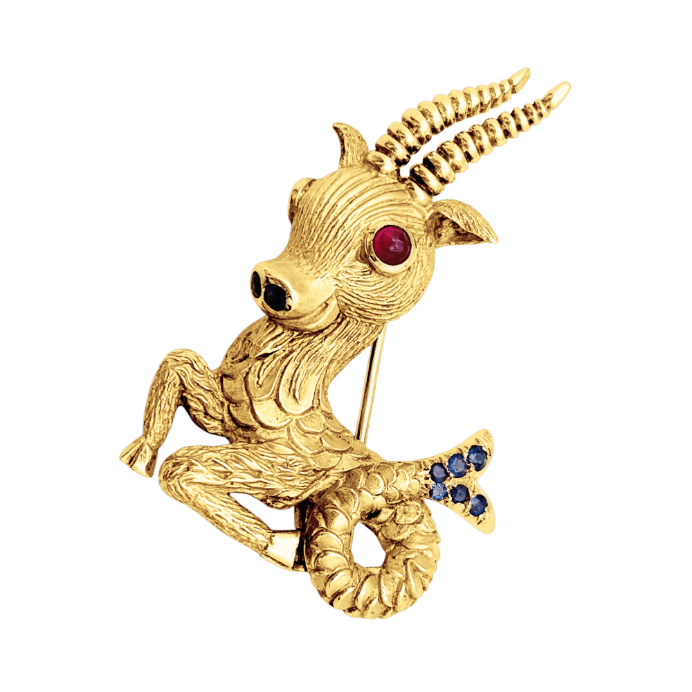 Broche Clip en or jaune, rubis et saphirs - Castafiore