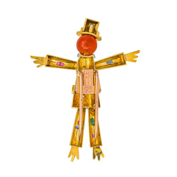 Broche Clip LAROCHE "Épouvantail" en or jaune, platine, cornaline, saphirs, rubis, émeraudes et diamants - Castafiore