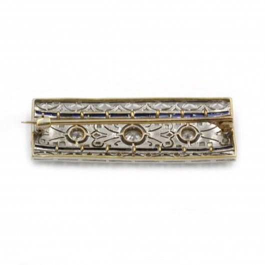 Broche en or blanc, platine, saphirs et diamants - Castafiore
