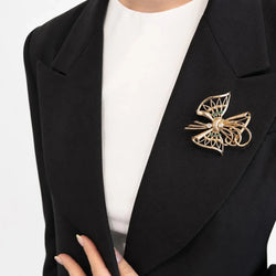 Broche en or jaune, émeraudes et diamants - Castafiore