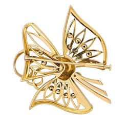 Broche en or jaune, émeraudes et diamants - Castafiore