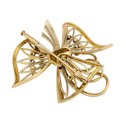 Broche en or jaune, émeraudes et diamants - Castafiore