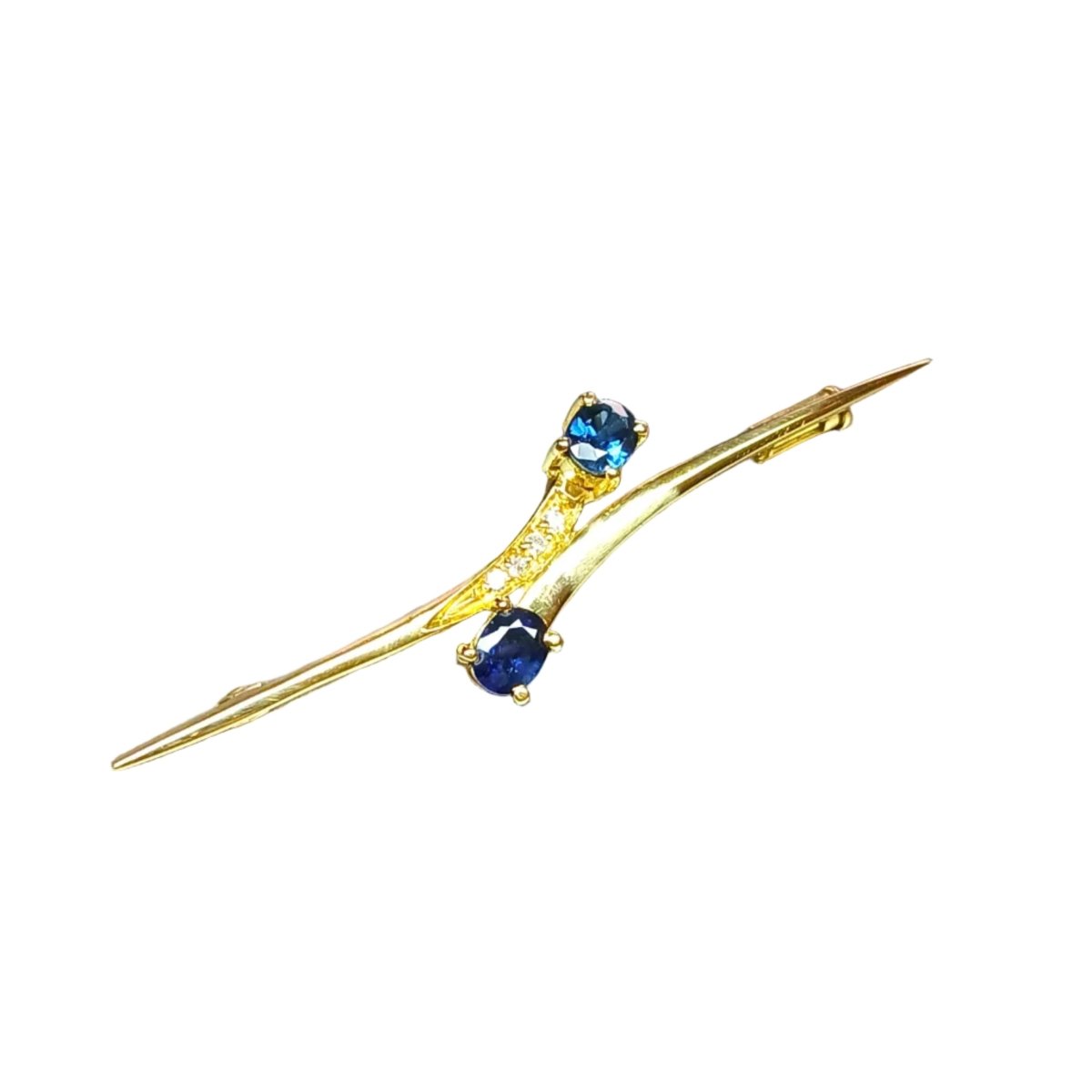 Broche en or jaune, saphirs et diamants - Castafiore